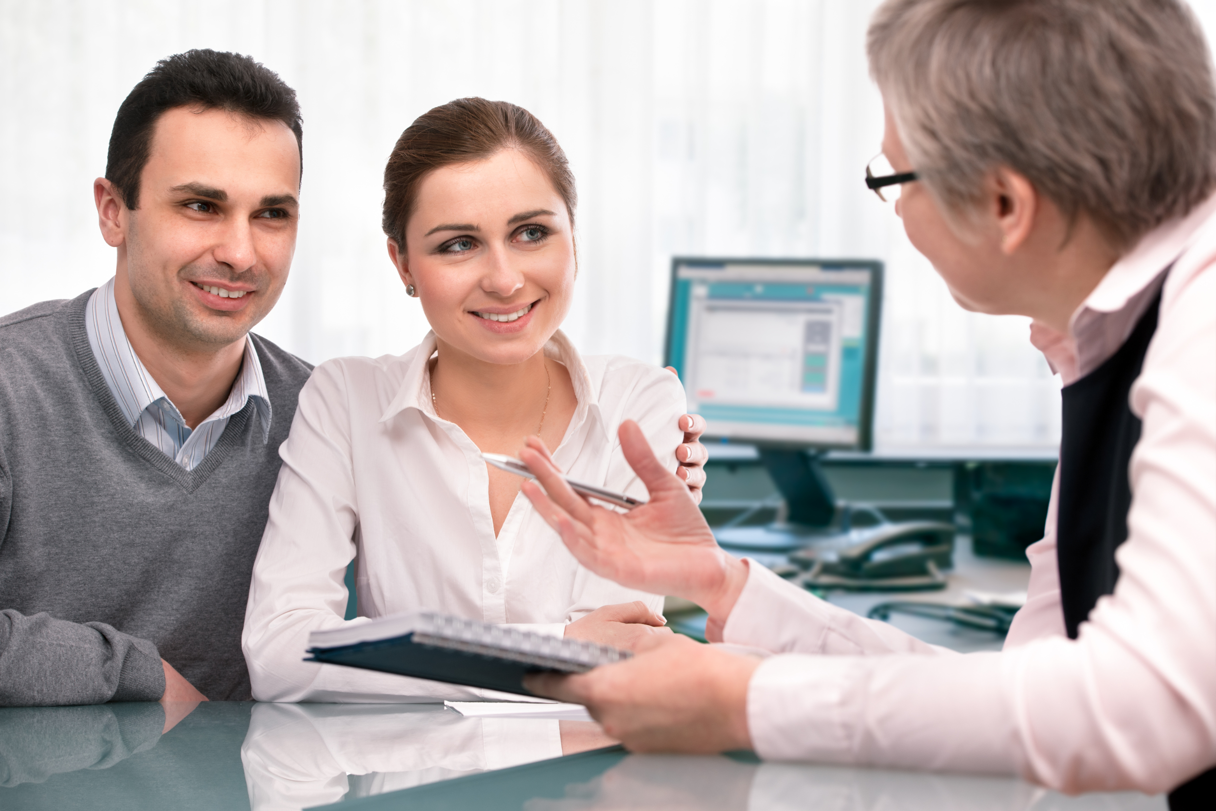 Young couple meeting with lender