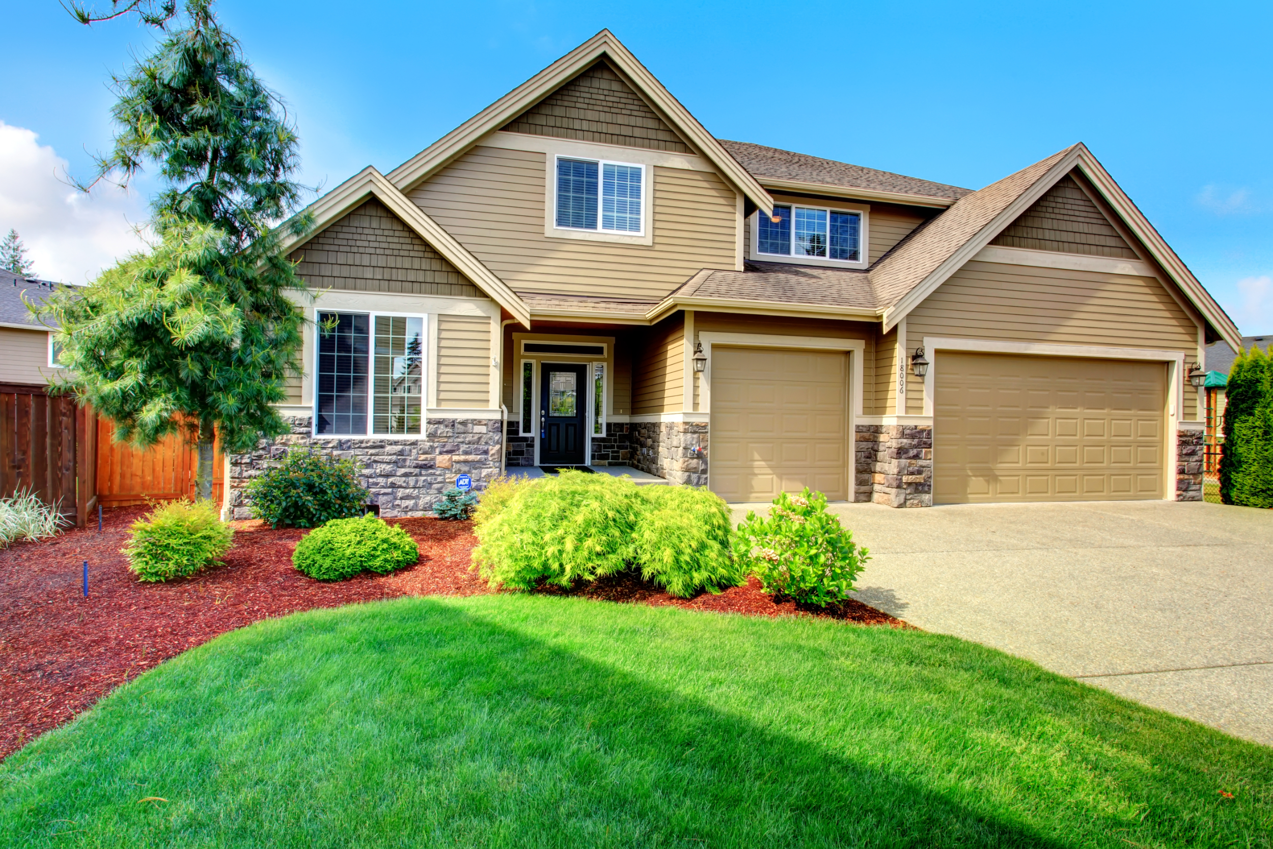 Large home with beautiful landscaping